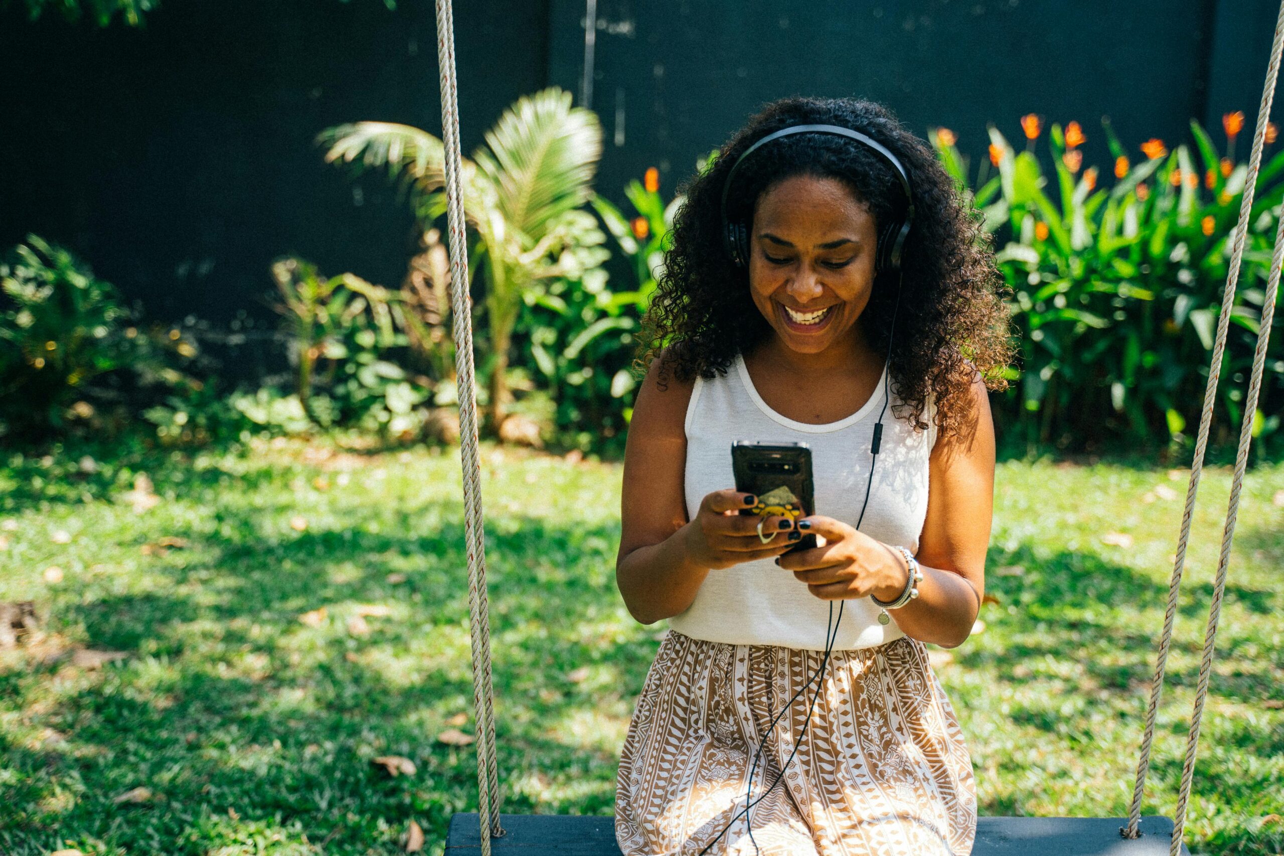 woman listening to podcast on her phone