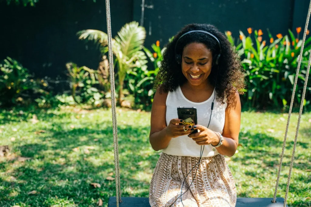 woman listening to podcast on her phone